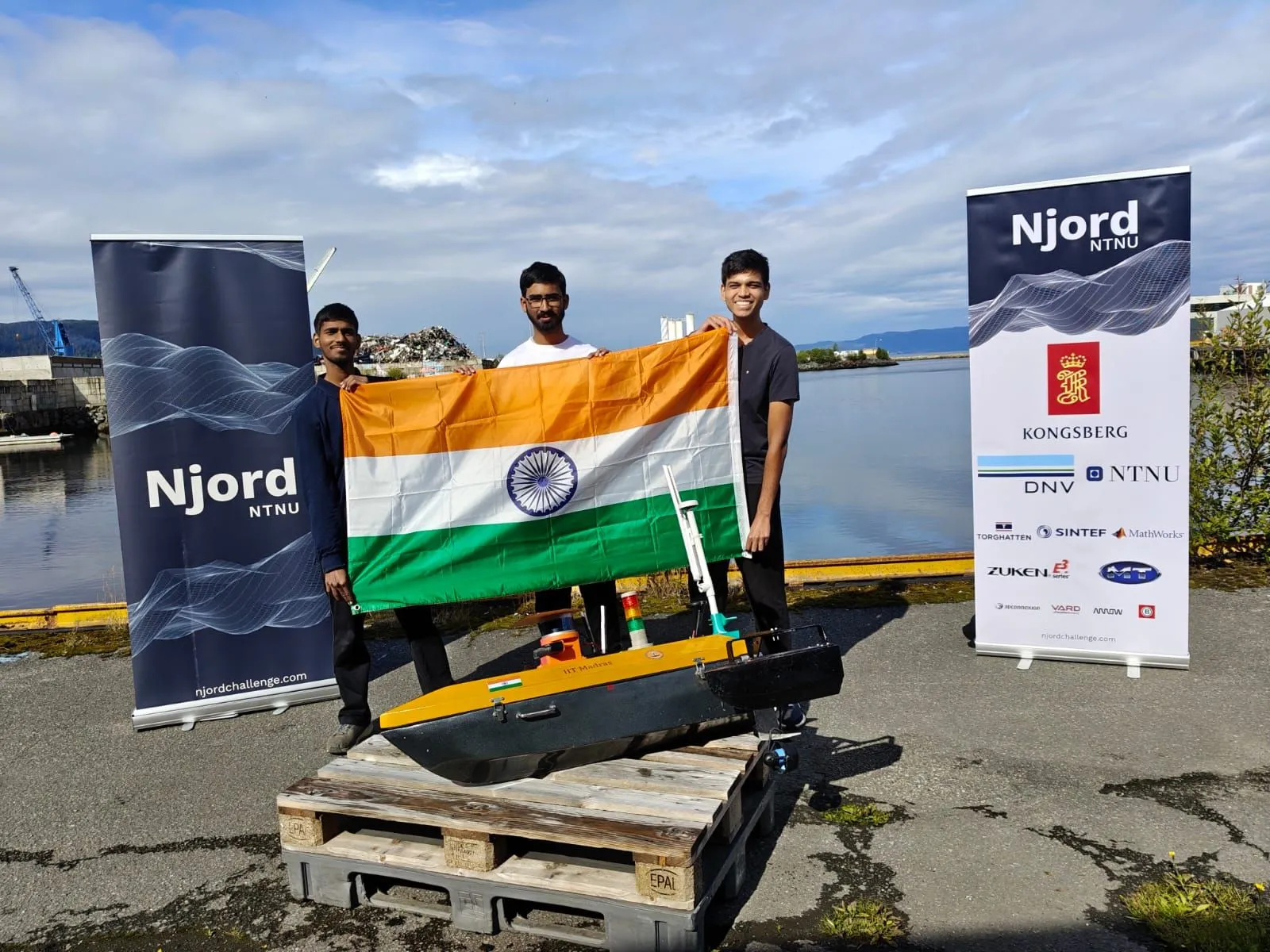 Team Aritra with their ASV and the Indian flag between Njord NTNU banners